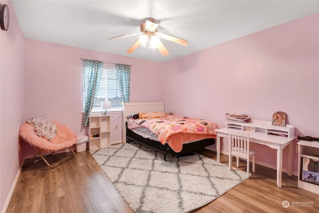 bedroom featuring light wood-type flooring and ceiling fan