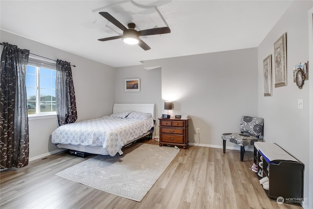 bedroom featuring ceiling fan and light hardwood / wood-style flooring