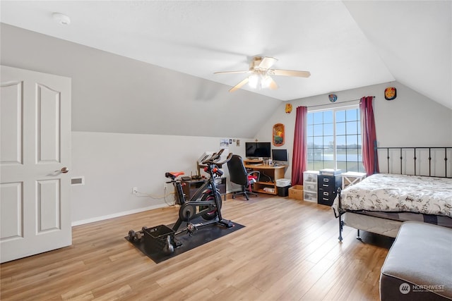 bedroom featuring vaulted ceiling, ceiling fan, and hardwood / wood-style flooring