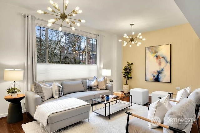 living room with a notable chandelier and hardwood / wood-style flooring