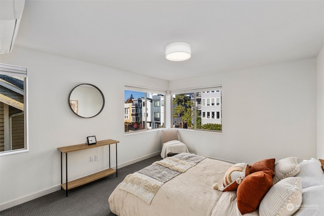 bedroom with dark colored carpet