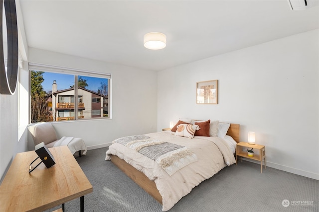 bedroom featuring dark carpet