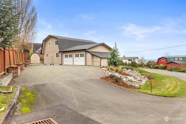 view of side of home featuring a garage