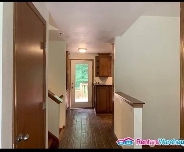 corridor featuring dark wood-type flooring