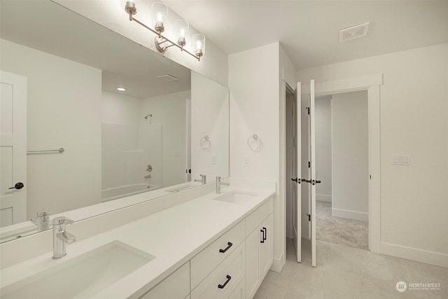 bathroom featuring shower / bathtub combination and vanity