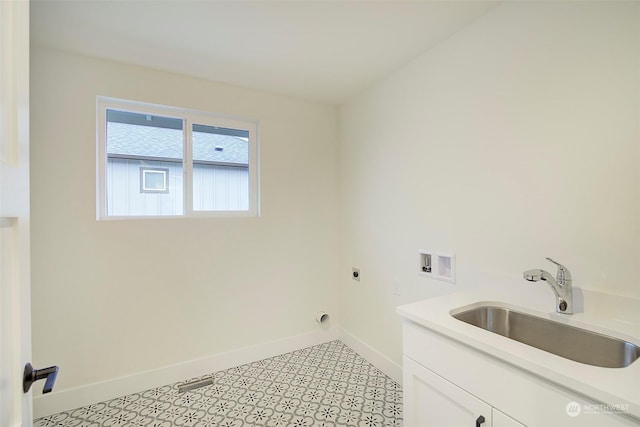 clothes washing area featuring washer hookup, sink, cabinets, and hookup for an electric dryer