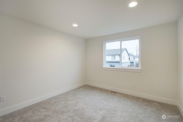 unfurnished room with carpet flooring