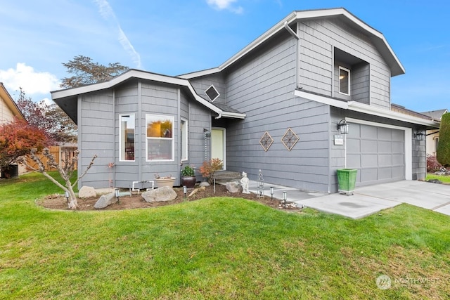 view of front of home featuring a front lawn and a garage