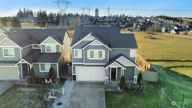 view of front of property with a garage and a front yard