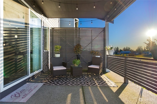 patio terrace at dusk with a balcony