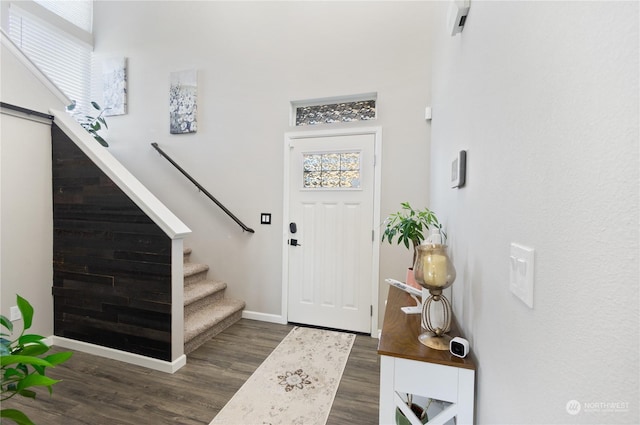 entryway with dark hardwood / wood-style floors