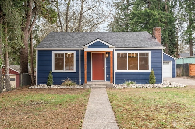 bungalow with a front lawn