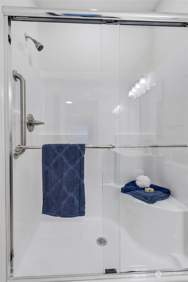 bathroom featuring an enclosed shower