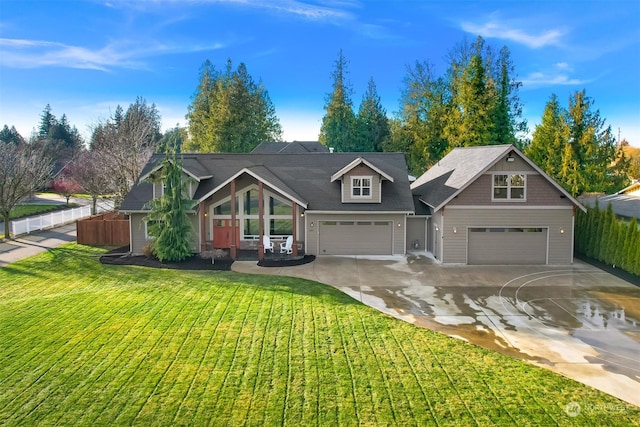 view of front facade featuring a front yard and a garage