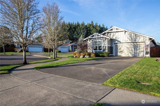 view of front of house with a garage and a front lawn