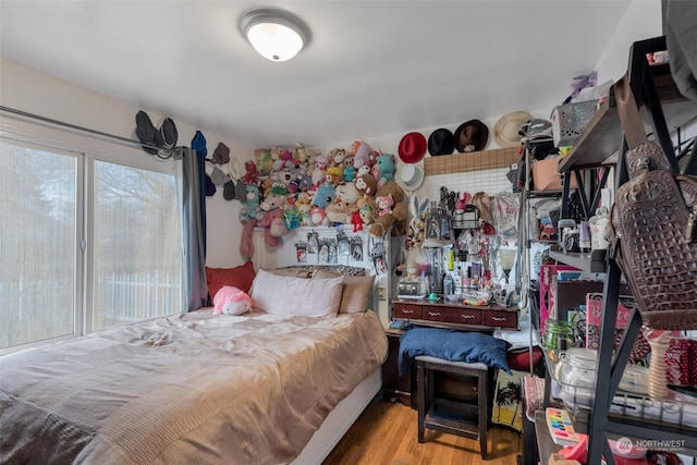 bedroom with light hardwood / wood-style floors