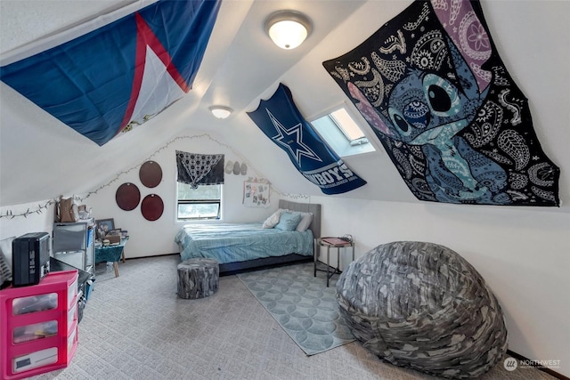 bedroom with carpet floors and vaulted ceiling