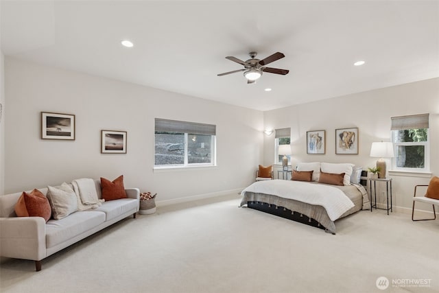 bedroom featuring carpet, multiple windows, and baseboards