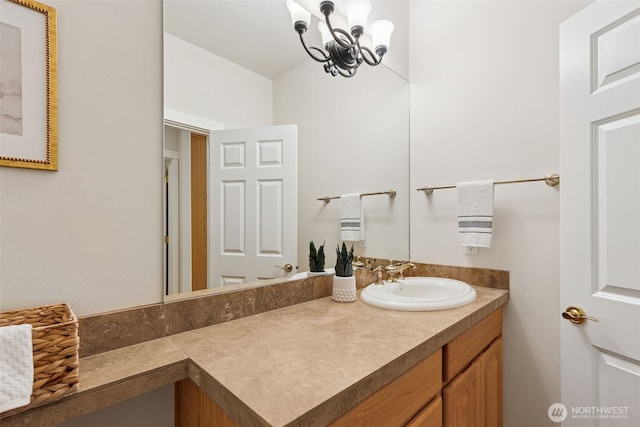 bathroom featuring vanity and an inviting chandelier