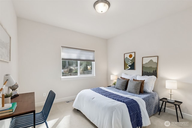 carpeted bedroom featuring baseboards