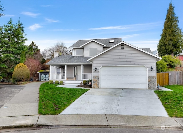 view of front of home featuring a porch, a front lawn, and a garage