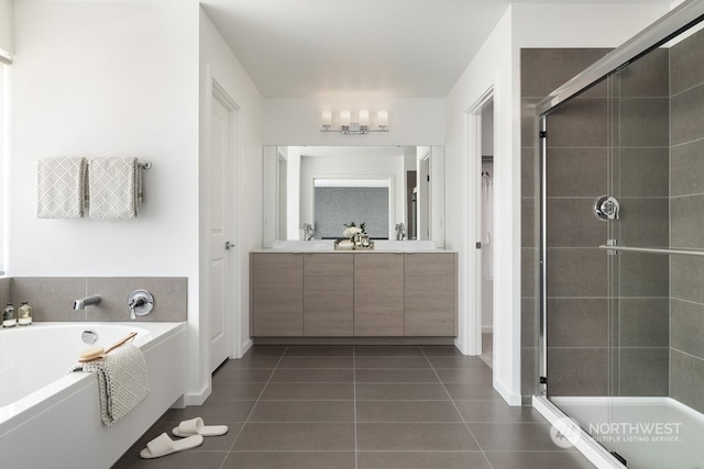 bathroom with shower with separate bathtub, tile patterned floors, and vanity