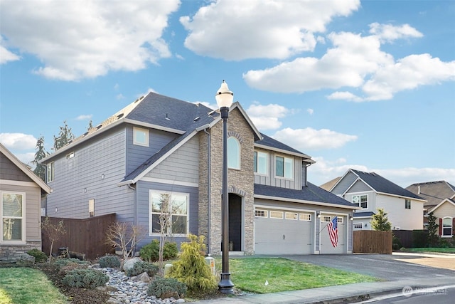 view of front of home with a garage and a front yard