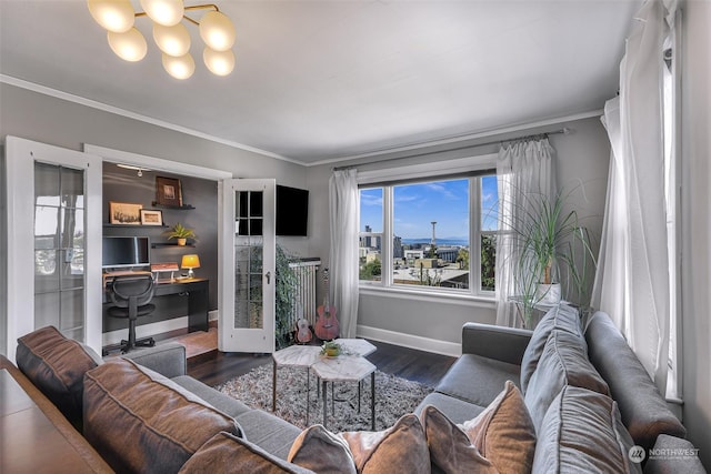 living room featuring french doors, dark hardwood / wood-style flooring, and ornamental molding