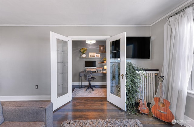 office featuring dark wood-type flooring, french doors, crown molding, and radiator