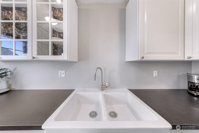 kitchen with sink and white cabinetry