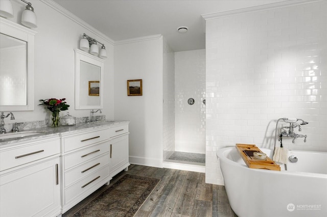 bathroom featuring hardwood / wood-style flooring, vanity, crown molding, and independent shower and bath