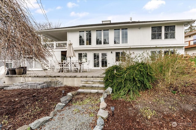 rear view of house with a patio area and a balcony