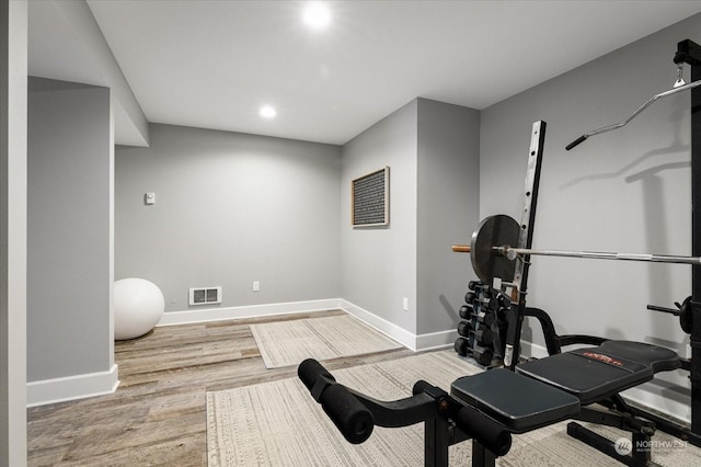 workout area featuring light hardwood / wood-style flooring