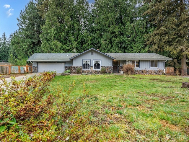 single story home with a front lawn and a garage