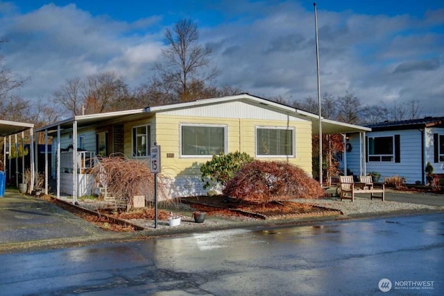 view of front of home with a carport