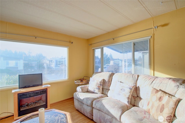 living area featuring a wealth of natural light and light wood-style floors