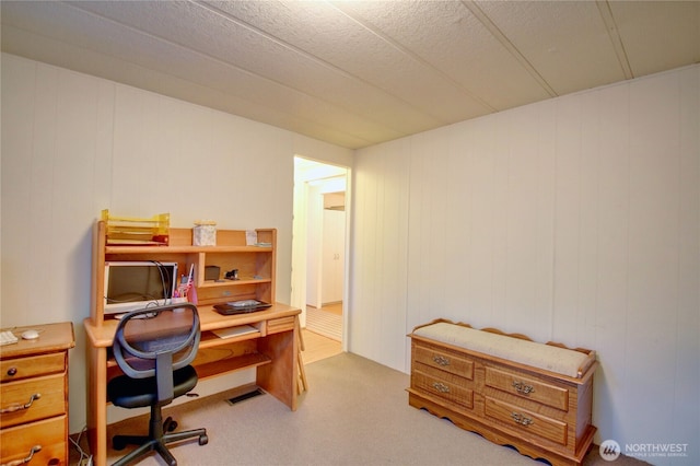 carpeted home office with visible vents