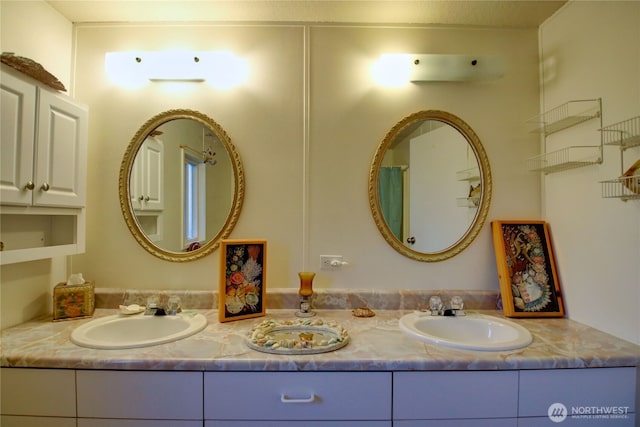 full bath featuring double vanity and a sink