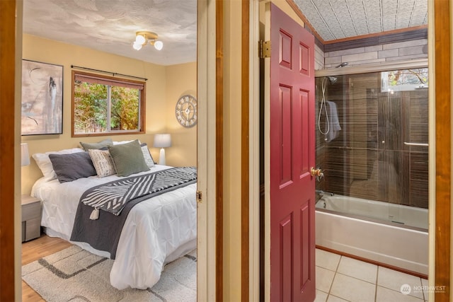 tiled bedroom featuring multiple windows