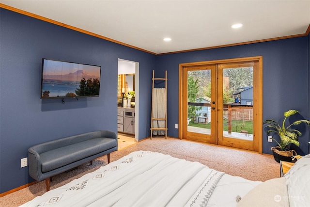 carpeted bedroom with access to outside, ensuite bathroom, french doors, and crown molding