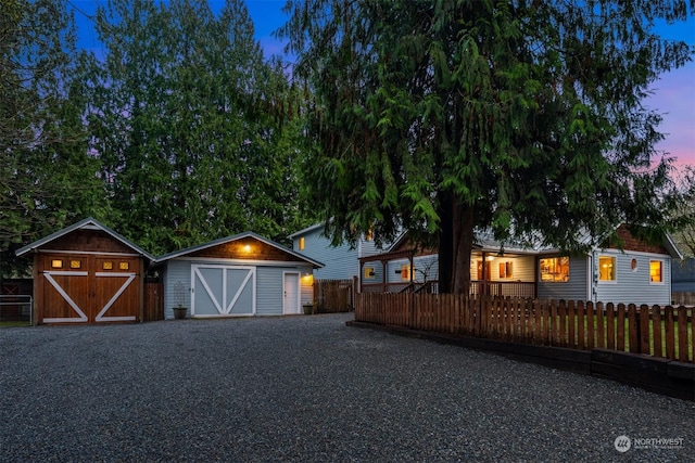 view of front of property featuring a storage unit