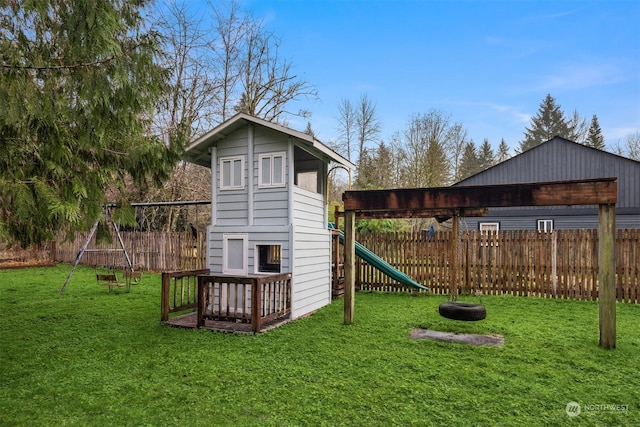 view of playground with a lawn