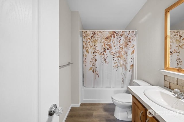 full bathroom featuring wood-type flooring, toilet, vanity, and shower / bath combo