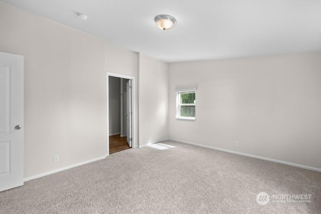 unfurnished room featuring carpet