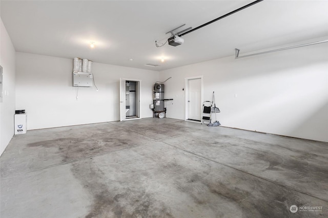 garage featuring secured water heater and a garage door opener