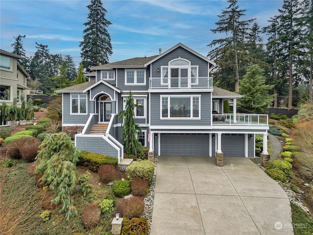 front of property with a balcony and a garage