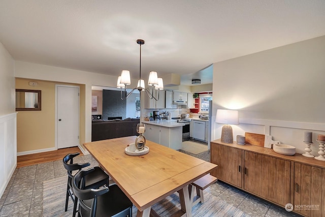 dining space featuring a notable chandelier