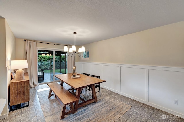 dining space with a notable chandelier