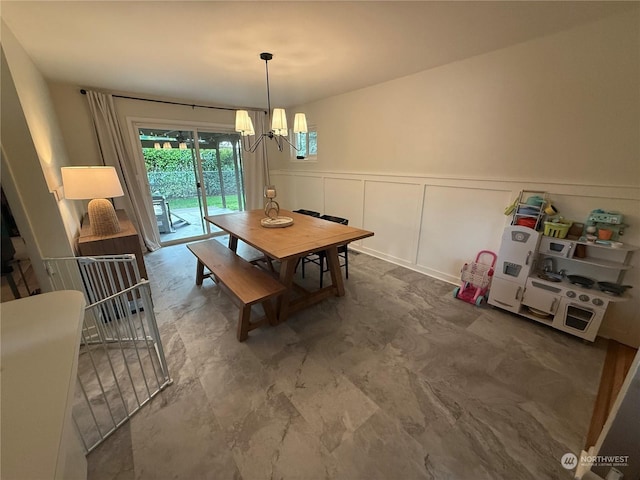 dining room with a notable chandelier