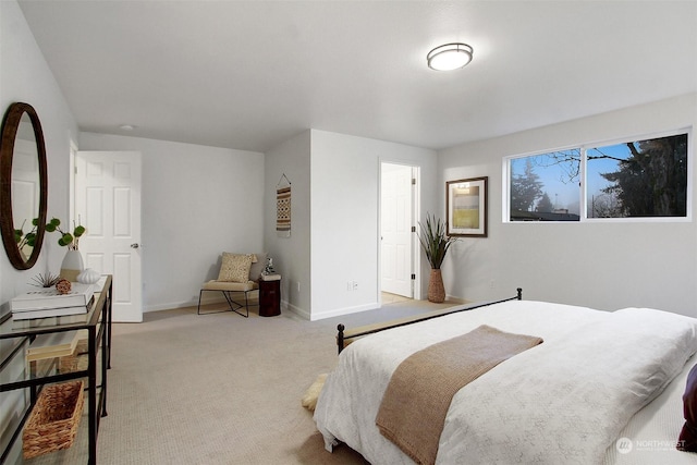 bedroom featuring light colored carpet